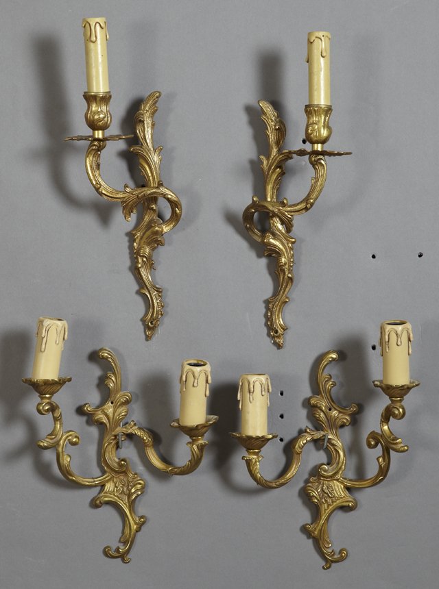 Group of Four Louis XV Style Brass Sconces, consisting: Group of Four Louis XV Style Brass Sconces, consisting of a pair of two light examples, and a pair of single light examples, all with scrolling leaf back plates, Two Lights- H.- 11 in., W.- 8 3/4 in.,