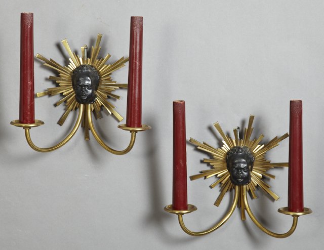 Pair of Gilt Bronze Two Light Sconces, the central: Pair of Gilt Bronze Two Light Sconces, the central Blackamoor face within a sunburst, electrified, H.- 9 7/8 in., W.- 10 1/2 in., D.- 4 1/2 in.