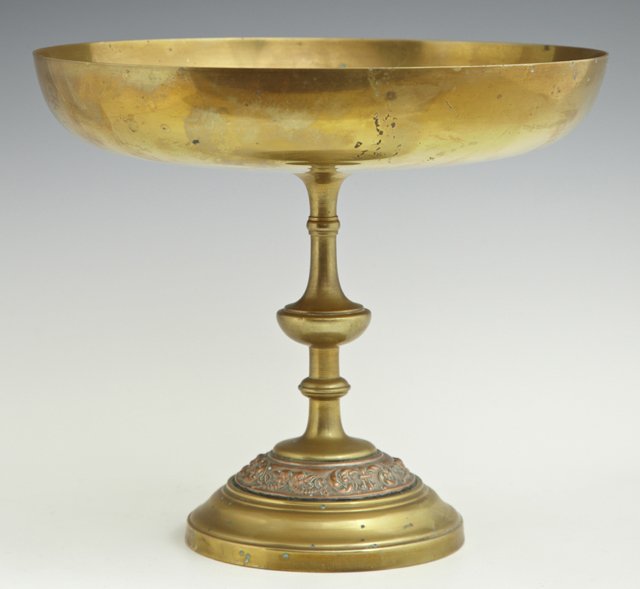 Copper and Brass Tazza, 19th c., the brass bowl top: Copper and Brass Tazza, 19th c., the brass bowl top with a central relief copper medallion of Venus at her toilette with putti in attendance, on a knopped support to a stepped base, H.- 7 3/4 in., Dia