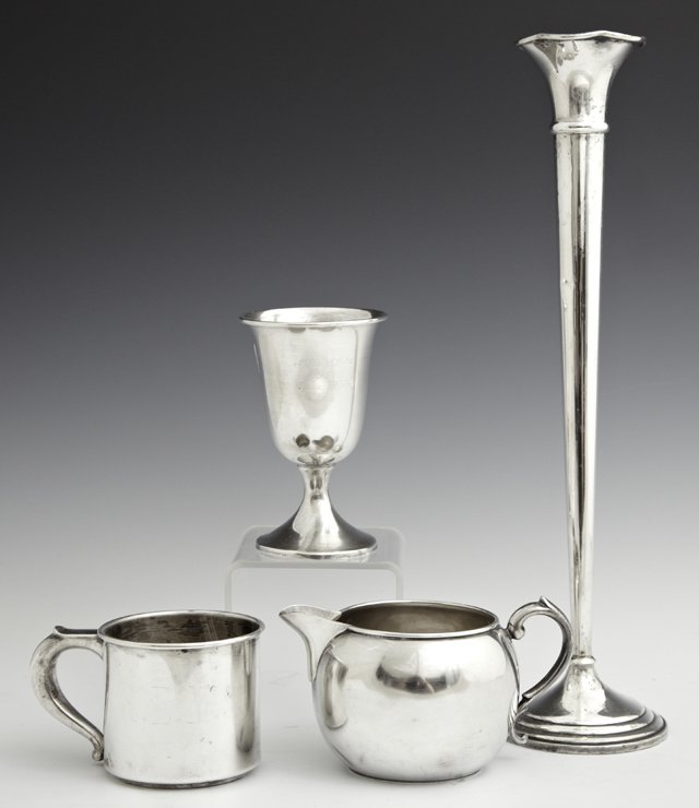 Four Sterling Pieces, consisting of a weighted bud: Four Sterling Pieces, consisting of a weighted bud vase, a mug by Wallace, a creamer by Manchester Silver Co., and a footed goblet, Wt.- 7.05 troy oz, without vase.