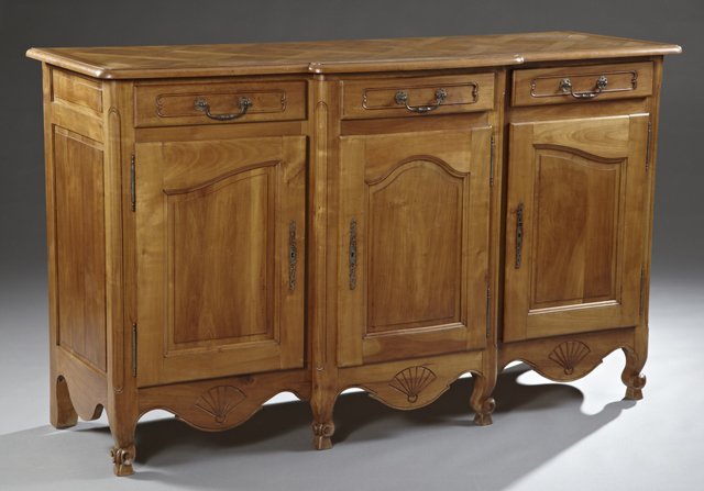 Louis XV Style Carved Cherry Bow Front Sideboard, 20th: Louis XV Style Carved Cherry Bow Front Sideboard, 20th c., the rounded corner parquetry inlaid top over a central frieze drawer and cupboard door, flanked by two set back frieze drawers over cupboard 