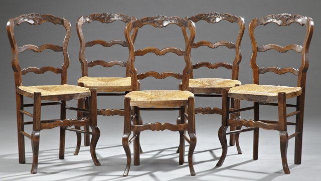 Set of Five Carved Beech Louis XV Style Ladder Back: Set of Five Carved Beech Louis XV Style Ladder Back Rush Seat Side Chairs, early 20th c., with arched crest rails with central floral basket and leaf carving, over rush seats, on rectangular and cabri