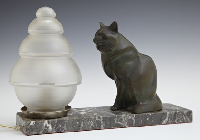 Art Deco Patinated Spelter Table Lamp, c. 1930, of a: Art Deco Patinated Spelter Table Lamp, c. 1930, of a cat, signed M. LeDuca, with a tapered stepped frosted geometric glass shade, on a highly figured octagonal gray marble base, H.- 8 in., W.- 11 3/4 