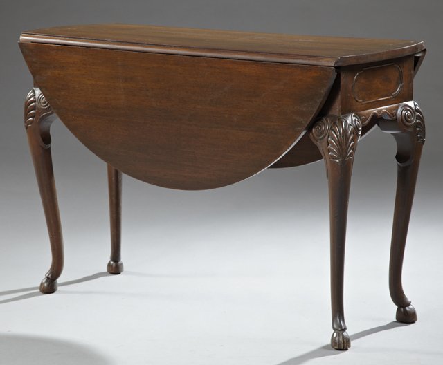 Carved Mahogany Queen Anne Style Oval Drop Leaf Tea: Carved Mahogany Queen Anne Style Oval Drop Leaf Tea Table, 19th c., on cabriole legs with shell carved knees, to hoof feet, H.- 29 1/2 in., W.- Closed- 17 in., Open- 44 in., D.- 44 in.