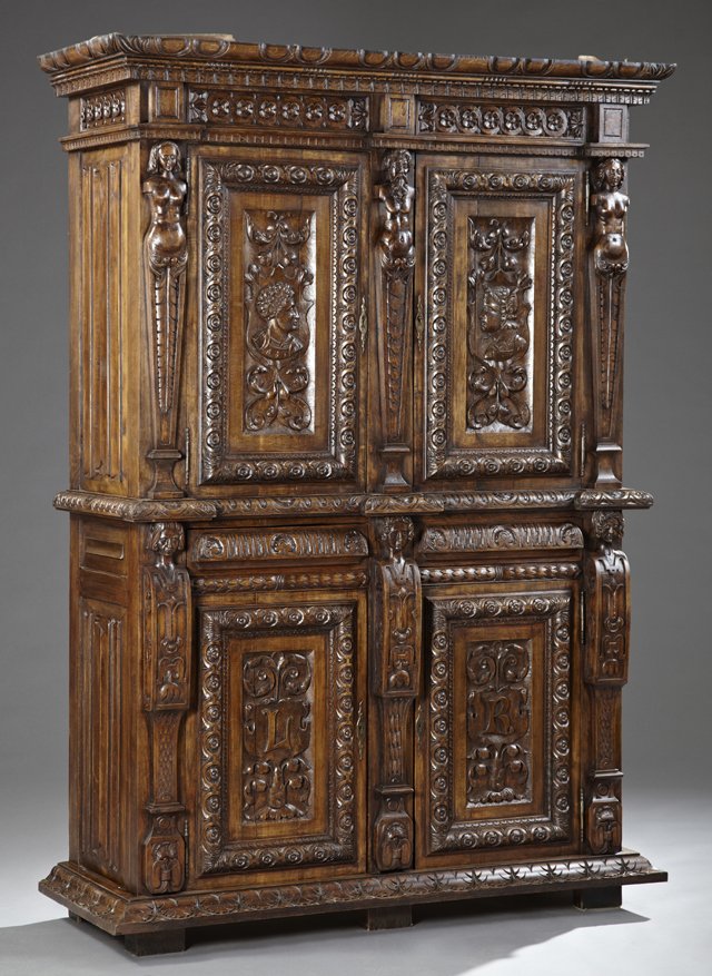 French Renaissance Style Carved Beech Buffet a Deux: French Renaissance Style Carved Beech Buffet a Deux Corps, 19th c., with an ogee crown over a floral carved frieze above figural carved double doors flanked by figural carved pilasters, on a base with