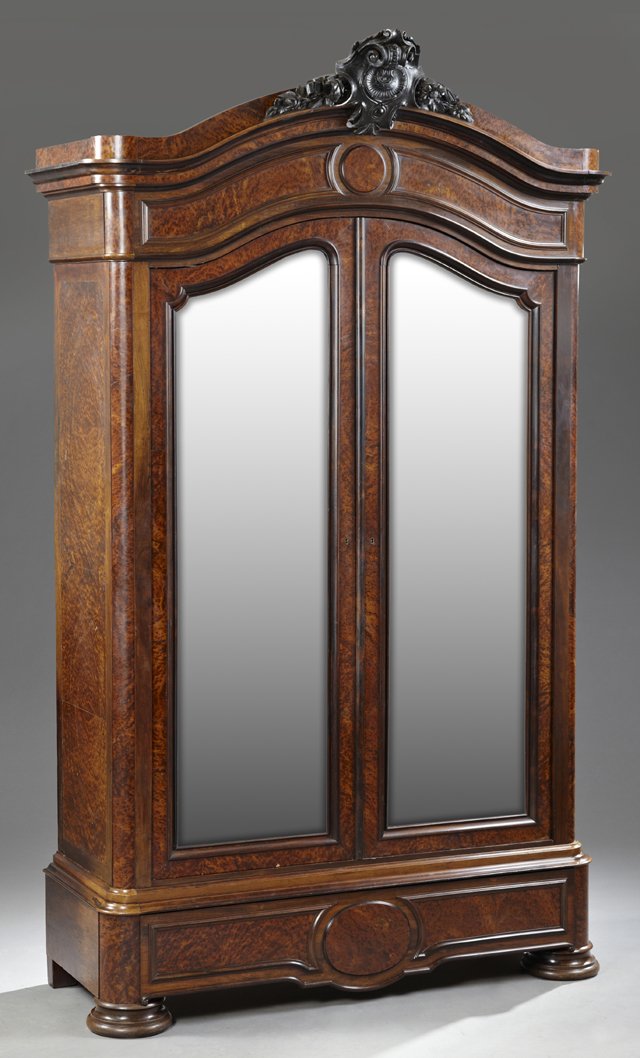 Exceptional French Carved Rosewood and Burled Elm: Exceptional French Carved Rosewood and Burled Elm Double Door Armoire, c. 1880, the arched crown with a central scroll and floral carved crest over the arched wide beveled mirror doors, above a deep d