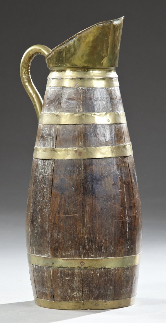 Brass and Oak Umbrella Stand, early 20th c., in the: Brass and Oak Umbrella Stand, early 20th c., in the form of a large ewer, H.- 27 in., W.- 11 in., D.- 10 in.