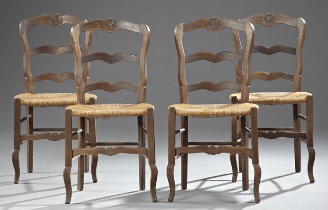 Set of Four French Provincial Carved Beech Ladderback: Set of Four French Provincial Carved Beech Ladderback Rush Seat Side Chairs, late 19th c., the arched backs with shell carved top rails, the whole on square cabriole legs, joined by stretchers, H.- 36