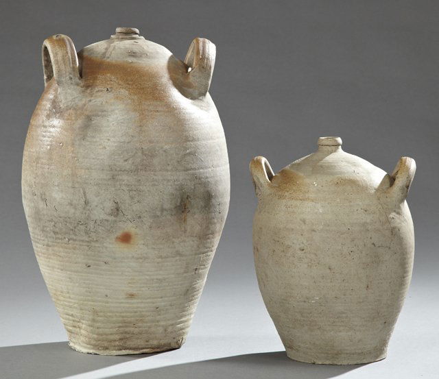 Pair of Earthenware Baluster Form Oil Jars, 19th c.,: Pair of Earthenware Baluster Form Oil Jars, 19th c., with applied ring handles, the smaller in yellow glazing, Larger- H.- 19 in., W.- 13 1/2 in., D.- 12 1/2 in.