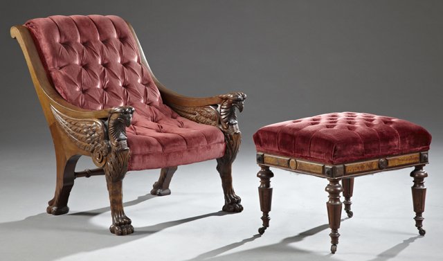 American Carved Mahogany Sleepy Hollow Armchair, 19th: American Carved Mahogany Sleepy Hollow Armchair, 19th c., with eagle head arms on carved wing supports, on bird legs to paw feet, with an associated American Renaissance Revival Footstool, the skirt w