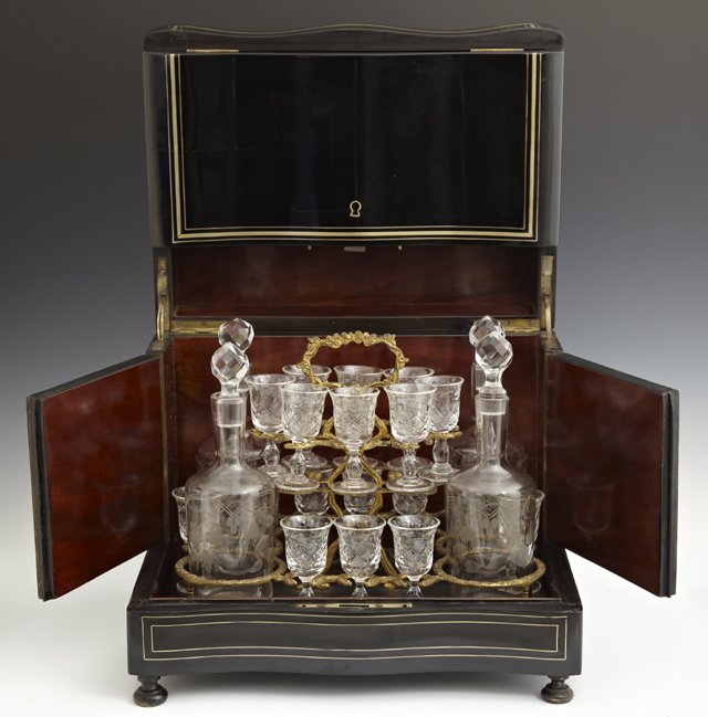 French Brass Inlaid Ebonized Cave a Liqueur, c. 1870,: French Brass Inlaid Ebonized Cave a Liqueur, c. 1870, the interior with a lift out bronze tray fitted with four etched glass decanters and sixteen etched glass liqueur glasses, H.- 10 1/2 in., W.- 13 