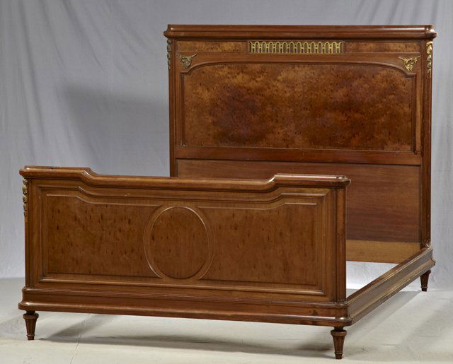 Louis XVI Style Carved and Ormolu Mounted Mahogany: Louis XVI Style Carved and Ormolu Mounted Mahogany Double Bed, early 20th c., the headboard with a stepped crown over a looped ormolu mount, above an arched highly figured panel, flanked by ormolu mou