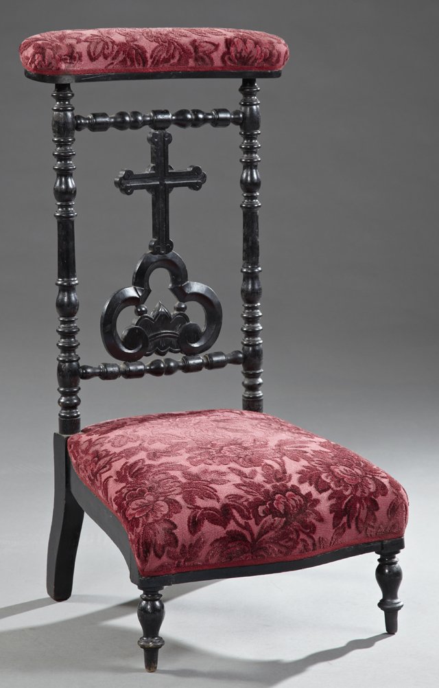 Ebonized Carved Beech Prie Dieu, c. 1880, the: Ebonized Carved Beech Prie Dieu, c. 1880, the upholstered arm rest on turned supports with a central pierced cross back splat, to a bowed seat, on turned tapered legs, H.- 36 3/4 in.