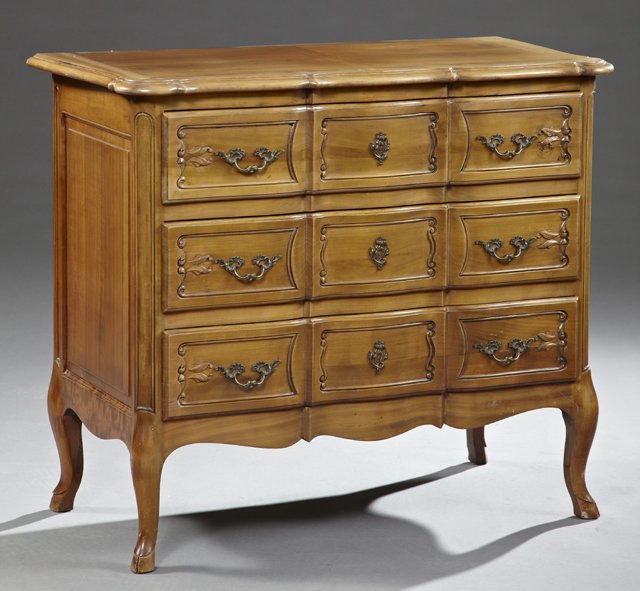 Louis XV Style Carved Cherry Bow Front Chest, 20th c.,: Louis XV Style Carved Cherry Bow Front Chest, 20th c., the stepped cookie corner top over three drawers, the whole on cabriole legs to hoof feet, H.- 31 1/2 in., W.- 35 1/2 in., D.- 18 1/4 in.