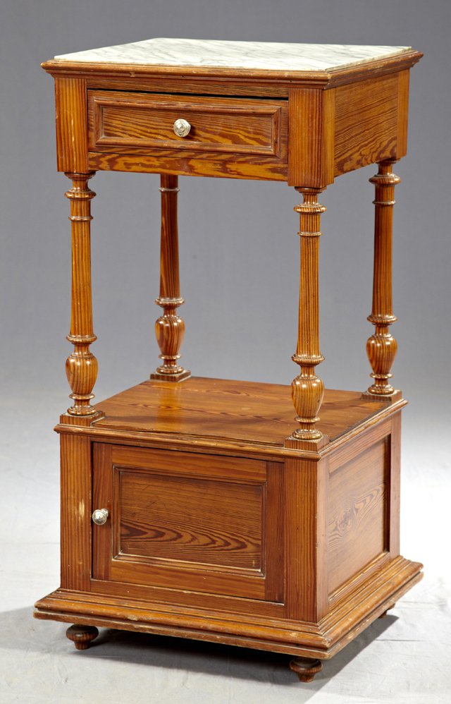 Pitch Pine Marble Top Night Stand, c. 1880, the inset: Pitch Pine Marble Top Night Stand, c. 1880, the inset figured white marble over a frieze drawer, on turned supports to a lower shelf over a pot cupboard, H.- 34 in., W.- 17 in., D.- 15 3/8 in.