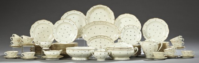 Eighty-Three Piece Set of Limoges Porcelain Dinnerware,: Eighty-Three Piece Set of Limoges Porcelain Dinnerware, c. 1900, with gilt rims and gilt floral decoration, consisting of eight soup bowls, twenty-six dinner plates, twelve saucers, fourteen cups, a s