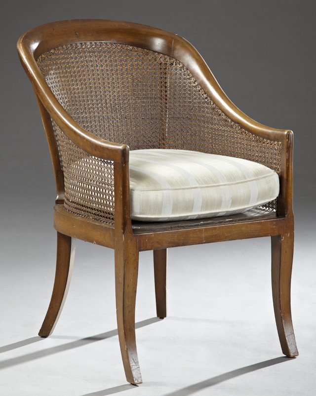 Continental Style Carved Mahogany Bergere, 20th c.,: Continental Style Carved Mahogany Bergere, 20th c., with a carved back and sides, over a cushioned seat, the whole on saber legs, H.- 34 1/2 in.