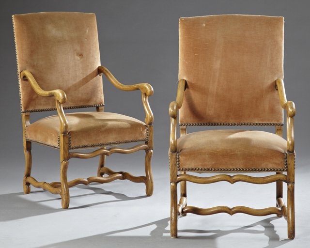Pair of Louis XIII Style Carved Beech Fauteuils, 20th: Pair of Louis XIII Style Carved Beech Fauteuils, 20th c., the square backs over scrolled arms, on cylindrical cabriole legs joined by cylindrical stretchers, now in tan velvet cord upholstery with bra