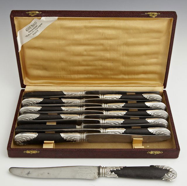 Set of Twelve French Dinner Knives, c. 1920, with ebony: Set of Twelve French Dinner Knives, c. 1920, with ebony handles with ornate silverplated mounts, in original leatherette presentation box.