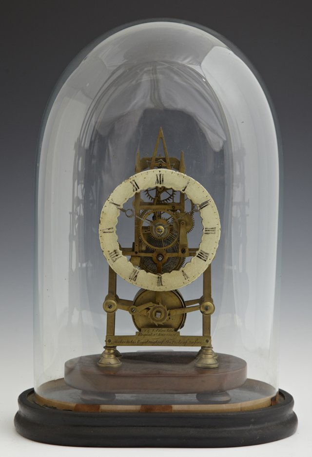 English Brass Skeleton Clock, 19th c., with a fusee: English Brass Skeleton Clock, 19th c., with a fusee movement by T.V.J. Blanchard, Regent St. London, makers to His Royal Highness the Duke of Sussex, presented in a blown glass dome on an ebonized bas