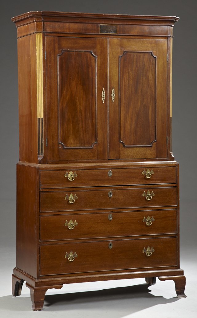 English Victorian Inlaid Mahogany Linen Press, 19th c,: English Victorian Inlaid Mahogany Linen Press, 19th c, the canted corner ogee crown over double doors concealing two sliding shelves, on a base with four graduated drawers, on ogee bracket feet, H.- 7