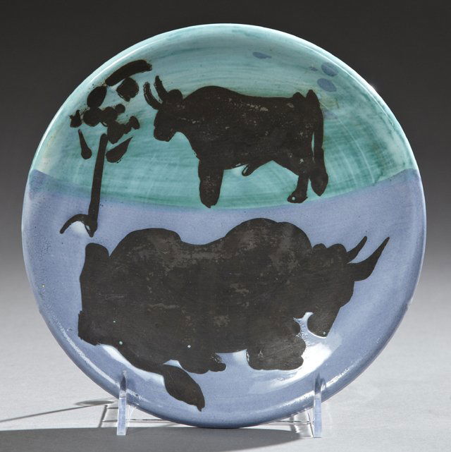 Pablo Picasso (1881-1973), "Toros," c. 1952, glazed: Pablo Picasso (1881-1973), "Toros," c. 1952, glazed earthenware plate, the underside impressed "Edition Picasso" twice and "Madoura, " Dia.- 7 3/4 inches.