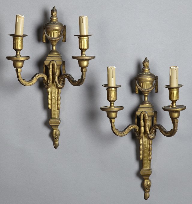 Pair of Louis XVI Style Bronze Two Light Sconces, late: Pair of Louis XVI Style Bronze Two Light Sconces, late 19th c., the tapered back plates with urn form surmounts and garland drapes, issuing scrolled relief decorated arms, H.- 17 in., W.- 10 1/4 in., 