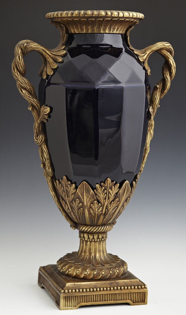 Gilt Bronze Mounted Cobalt Porcelain Handled Vase, of: Gilt Bronze Mounted Cobalt Porcelain Handled Vase, of tapered dodecahedron form, with bronze branch form handles, on a bronze socle support to a stepped square base, H.- 19 in., W.- 11 in., D.- 7 in.