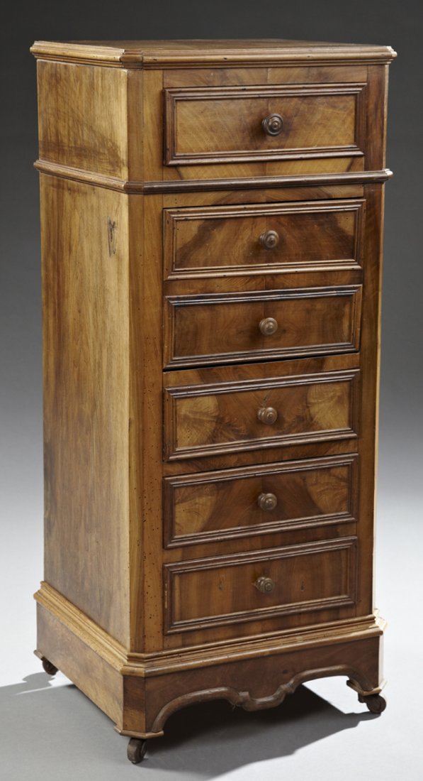 Louis Philippe Style Carved Walnut Nightstand, early: Louis Philippe Style Carved Walnut Nightstand, early 20th c., the canted stepped edge walnut top over a frieze drawer, a faux two drawer dropfront pot cupboard, and three lower drawers, on a plinth ba