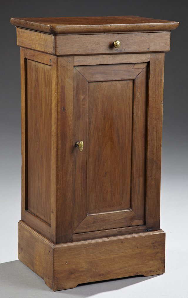Louis Philippe Carved Walnut Nightstand, c. 1880, the: Louis Philippe Carved Walnut Nightstand, c. 1880, the top with carved rounded edge over a conforming frieze drawer and a recessed panel cabinet door, on a plinth base with small block feet, H.- 30 1/4