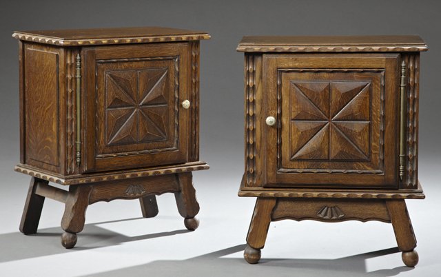 Pair of Provincial Jacobean Style Carved Oak: Pair of Provincial Jacobean Style Carved Oak Nightstands, 20th c., the raised panel top with a scalloped edge, supported on a block form body with a single raised panel geometric carved pot cupboard, 