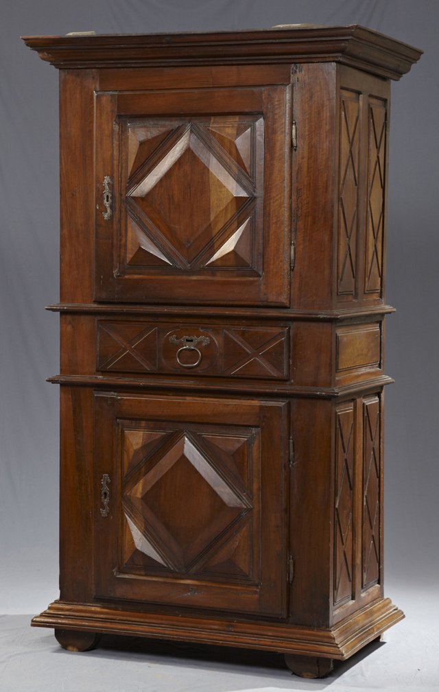 Louis XIII Style Carved Walnut Homme Debout, c. 1700,: Louis XIII Style Carved Walnut Homme Debout, c. 1700, the stepped ogee crown over a geometric relief door with a steel escutcheon and steel fiche hinges, over an X-incised drawer with a steel ring pul
