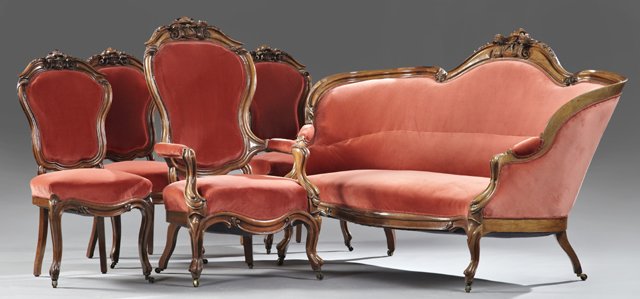 American Five Piece Carved Rosewood Parlor Suite, c.: American Five Piece Carved Rosewood Parlor Suite, c. 1860, possibly New Orleans, consisting of three side chairs, an armchair and settee, all with shaped crest rails, decorated in high relief carved r