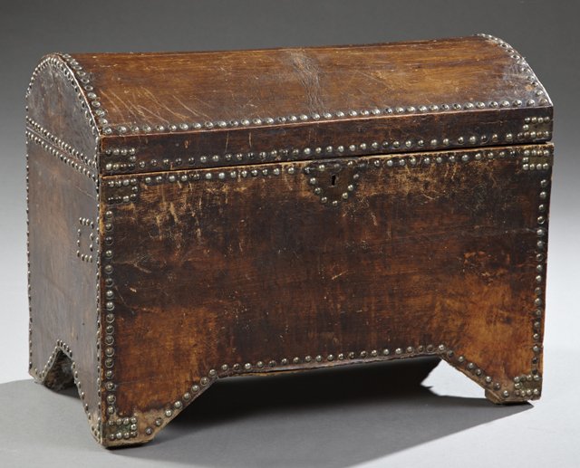Diminutive Spanish Leather Covered Domed Trunk, c.: Diminutive Spanish Leather Covered Domed Trunk, c. 1890, the traditional style trunk covered with leather and a nail head trim, having a red fabric lined interior, the whole on bracket feet, H.- 18 1/
