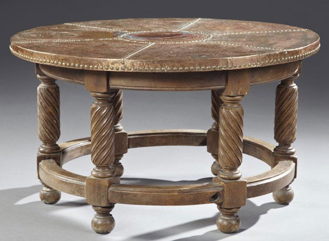 Rustic Louis XIII Style Carved Walnut and Copper Coffee: Rustic Louis XIII Style Carved Walnut and Copper Coffee Table, 20th c., the circular top covered in hammered copper with brass nail head trim, supported on a circular shaped base, having twist carved
