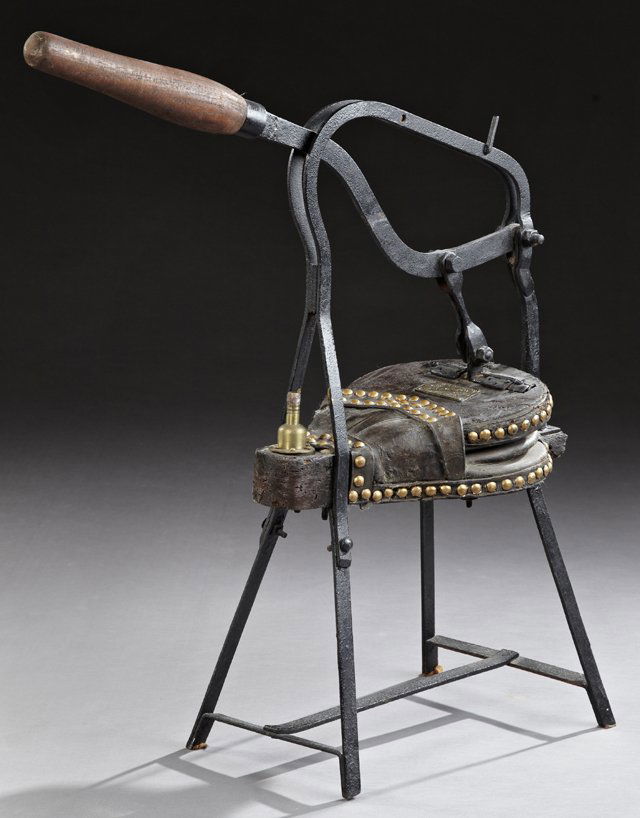 Leather Bellows, 19th c., labeled Foucheraud-Robichon,: Leather Bellows, 19th c., labeled Foucheraud-Robichon, with a mahogany pump handle, on an iron stand, on spayed legs joined by rectangular stretchers, H.- 34 in., W.- 30 in., D.- 12 in.