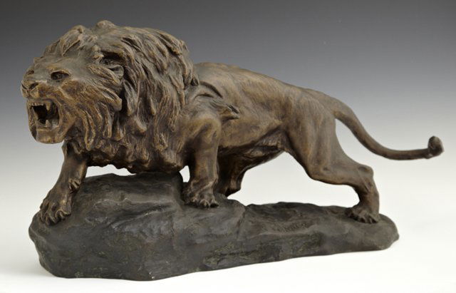 After Thomas Cartier (1879-1943), Patinated Spelter: After Thomas Cartier (1879-1943), Patinated Spelter Figure of a Male Lion, 20th c., H.- 11 1/2 in., W.- 22 1/2 in., D.- 7 in.