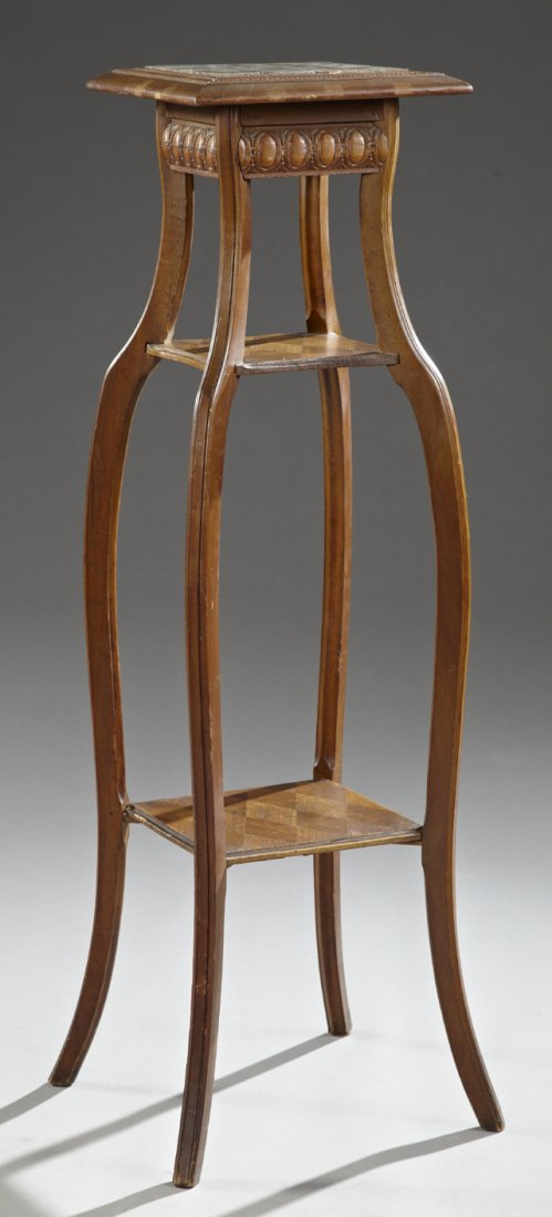 Carved Walnut Marble Top Plant Stand, c. 1900, the: Carved Walnut Marble Top Plant Stand, c. 1900, the inset brown marble over splayed legs joined by an upper parquetry inlaid shelf and a like lower shelf, H.- 43 in., W.- 12 in., D.- 12 in.