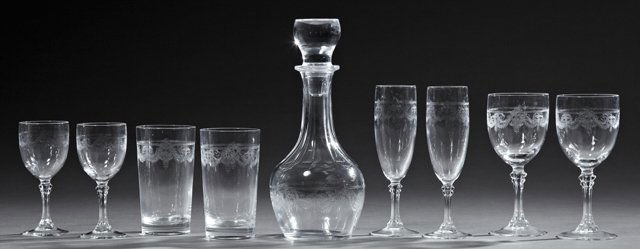 Fifty-Six Piece Set of French Crystal, 20th c.,: Fifty-Six Piece Set of French Crystal, 20th c., consisting of eight water glasses, twelve white wines, twelve red wines, eleven champagne flutes, twelve cordials, and a decanter, all with relief leaf