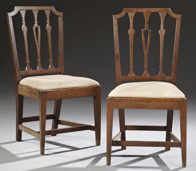 Pair of Hepplewhite Style Carved Mahogany Arrow Back: Pair of Hepplewhite Style Carved Mahogany Arrow Back Chairs, c. 1900, the shield form back with a pierced splat, to a trapezoidal slip seat, all on tapered square legs, H.- 37 1/2 in., W.- 19 in., D.-