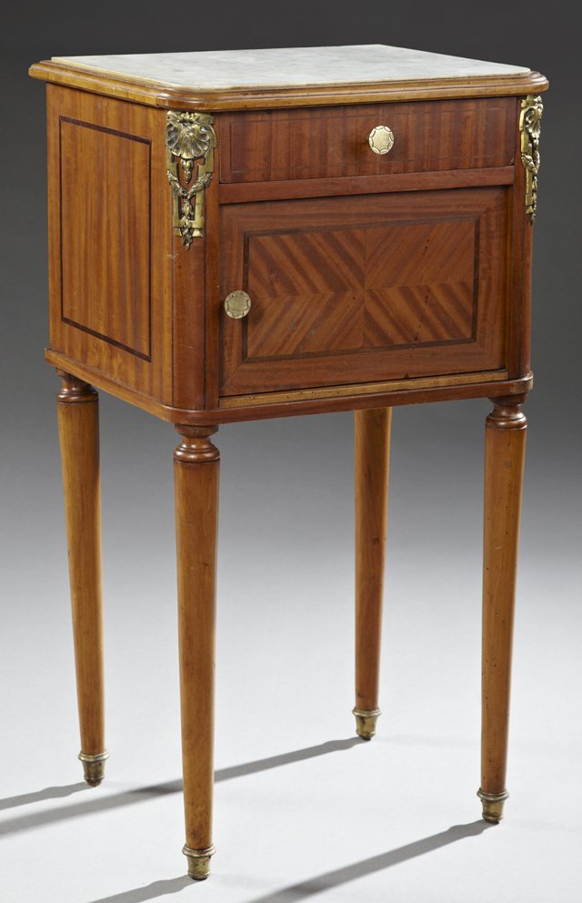 Louis XVI Style Marble Top Parquetry Inlaid Ormolu: Louis XVI Style Marble Top Parquetry Inlaid Ormolu Mounted Mahogany Nightstand, early 20th c., the inset rounded corner white marble over a frieze drawer with satinwood banding and a single parquetry 