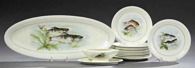 Fourteen Piece Ceramic Fish Set, 20th c., by Gien,: Fourteen Piece Ceramic Fish Set, 20th c., by Gien, consisting of twelve plates, a sauce boat, and a platter, all with transfer decoration of fish, Platter- H.- 1 1/2 in., W.- 26 1/2 in., D.- 10 in.