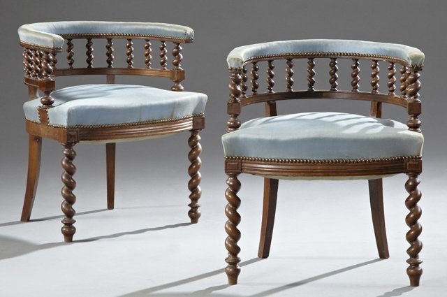 Pair of Carved Beech Jacobean Style Roundabout: Pair of Carved Beech Jacobean Style Roundabout Upholstered Armchairs, c. 1900, the upholstered backs on rope twist spindled supports, over bowed seats on rope twist legs, H.- 28 1/4 in.