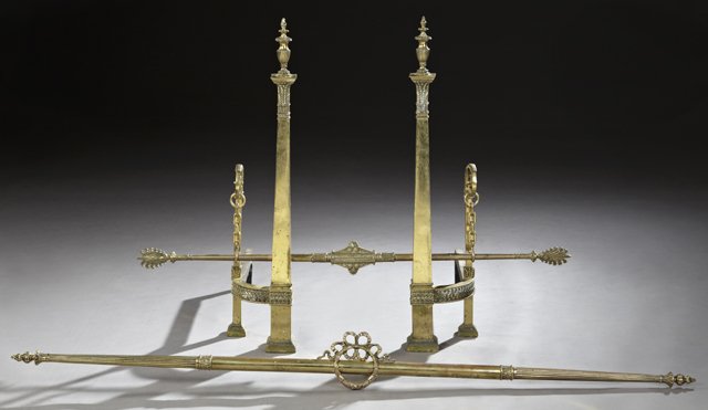 Neoclassical Bronze Fireplace Set, 20th c., consisting: Neoclassical Bronze Fireplace Set, 20th c., consisting of a pair of tapered square andirons, joined by a hanging chenet, together with a bronze fireplace fender, Andirons- H.- 32 in., W.- 6 1/2 in. (4