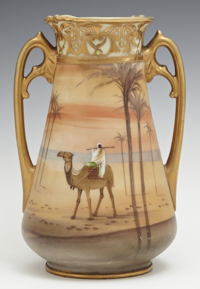 Nippon Handled Vase, 20th c., of tapered form with gilt: Nippon Handled Vase, 20th c., of tapered form with gilt and moriage decoration and a hand painted desert scene with palm trees, H.- 7 in., W.- 5 in., D.- 4 1/4 in.