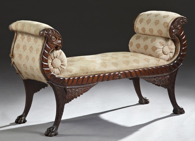 American Classical Carved Mahogany Window Seat, c.: American Classical Carved Mahogany Window Seat, c. 1900, the bench seat within double scrolled cornucopia arms, over winged feather carved splayed legs, on claw feet, H.- 28 1/2 in., W.- 47 in., D.- 1