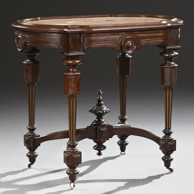 American Renaissance Revival Carved Mahogany Marble: American Renaissance Revival Carved Mahogany Marble Turtle Top Center Table, 19th c., the inset highly figured salmon marble, over a shaped carved apron with applied roundel decoration, on tapered ree