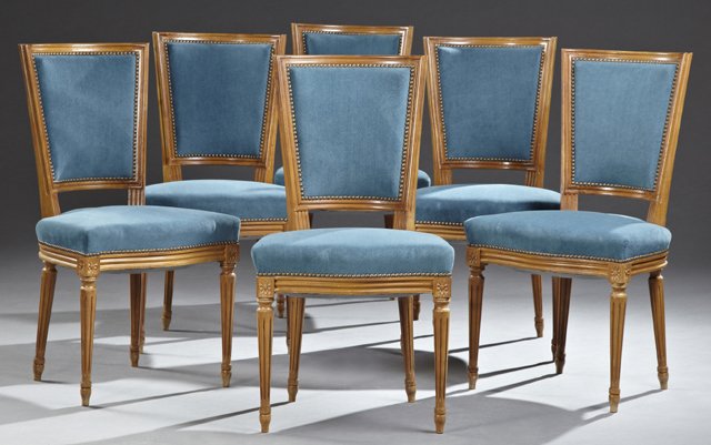 Set of Six Louis XVI Style Carved Cherry Dining Chairs,: Set of Six Louis XVI Style Carved Cherry Dining Chairs, 20th c., the reeded tapered backs over bowed seats, on tapered reeded legs on French toes, now in blue upholstery with brass tack trim, H.- 35 1