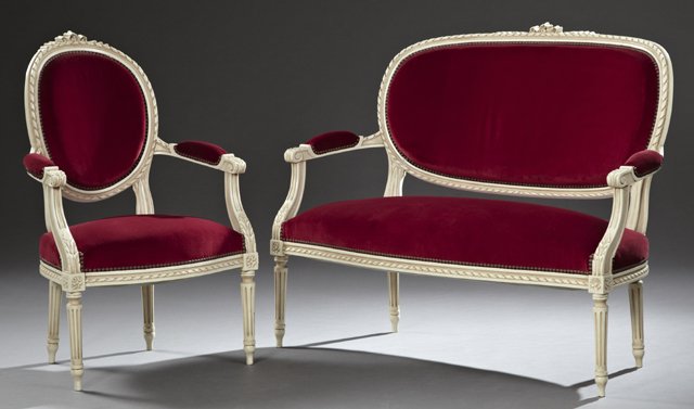 Two Piece Louis XVI Style Parlor Suite, 20th c.,: Two Piece Louis XVI Style Parlor Suite, 20th c., consisting of a settee and a fauteuil with pierced beribboned crests and edges, with medallion backs to padded arms, over bowed seats, on tapered reede