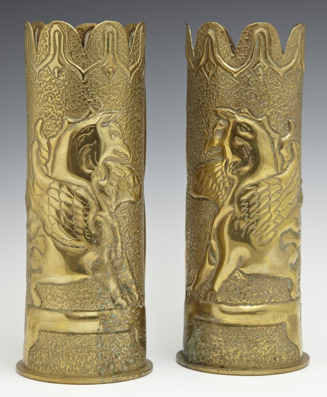 Pair of Brass Trench Art Vases, c. 1918, with scalloped: Pair of Brass Trench Art Vases, c. 1918, with scalloped rims, the pokerwork sides with repousse decoration of winged gryphons, H.- 9 in., Dia.- 3 1/2 in.
